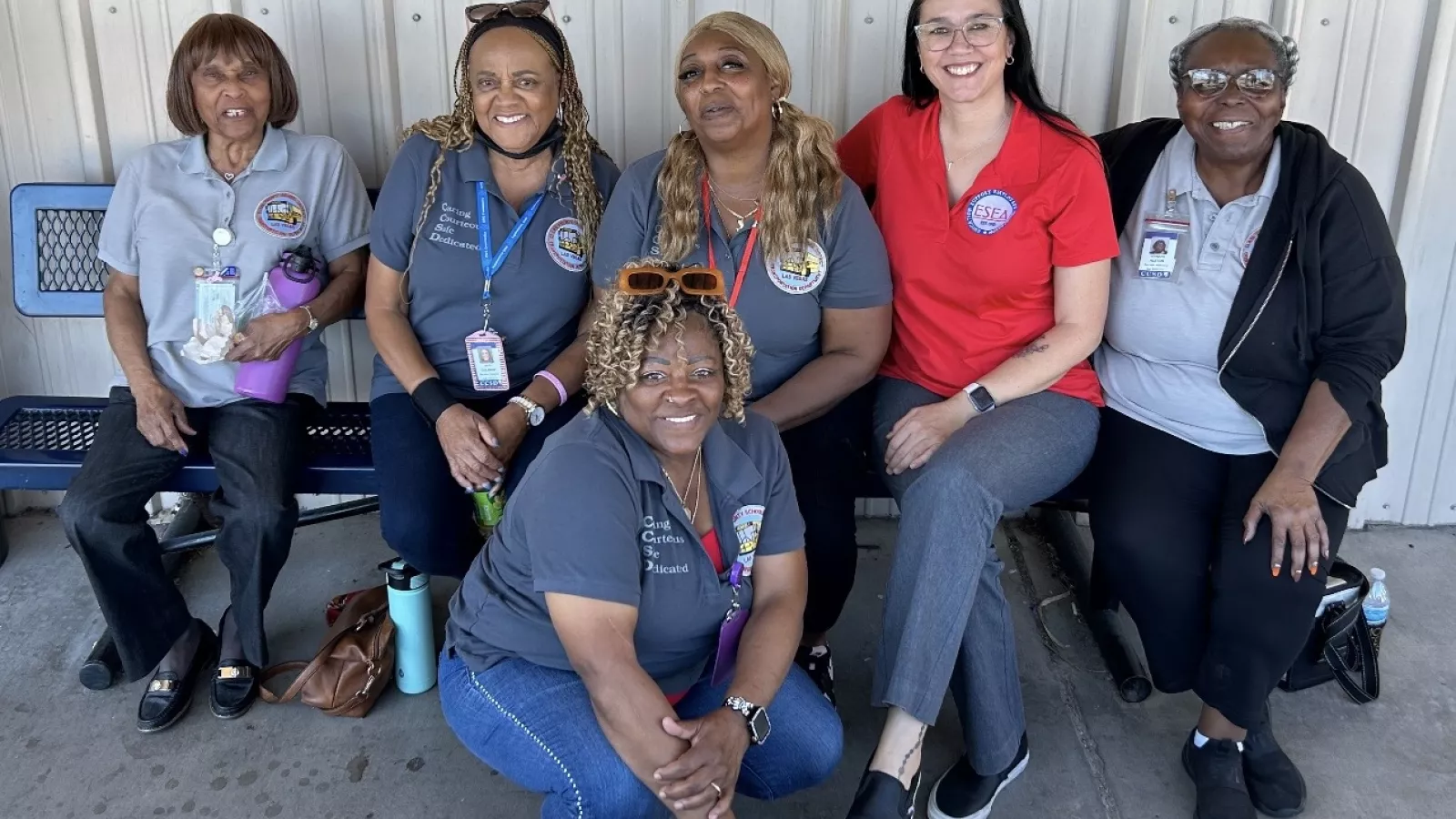 ESEA members pose for a quick picture on a bench