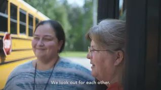 A shot of two ESPs standing outside with the caption "we look out for each other"