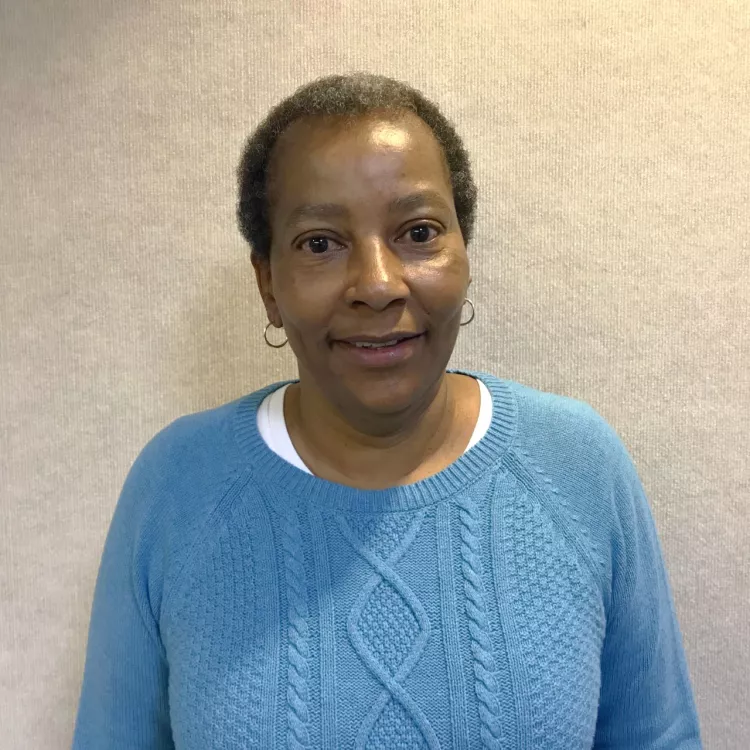 Debra Brewster smiles for a picture.